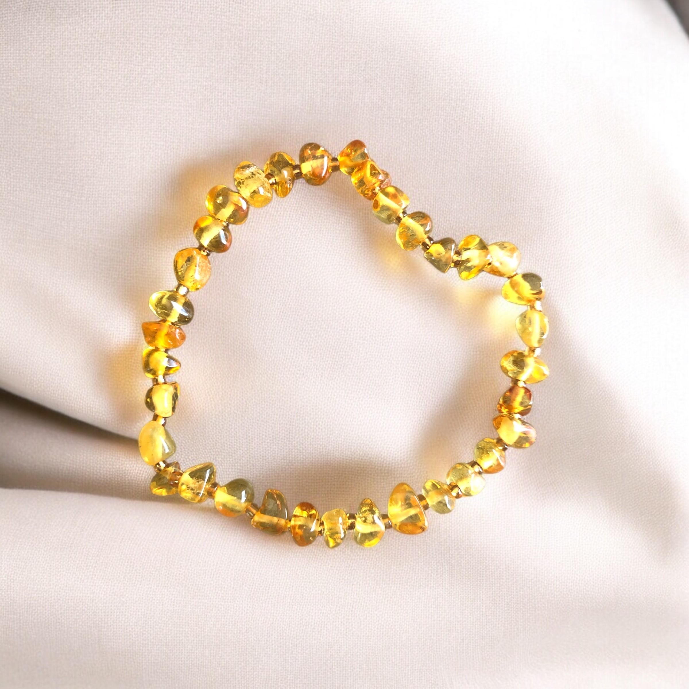 BRACELET BOULE 06MM AMBRE JAUNE AA FORME NATURELLE (05-06MM)